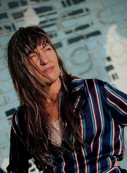 Marj Hahne looking off into the distance in an edgy photo. Photo Credit Dona Laurita